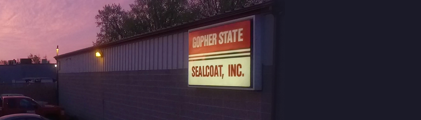 sign on building reading 'gopher state sealcoat, inc'
